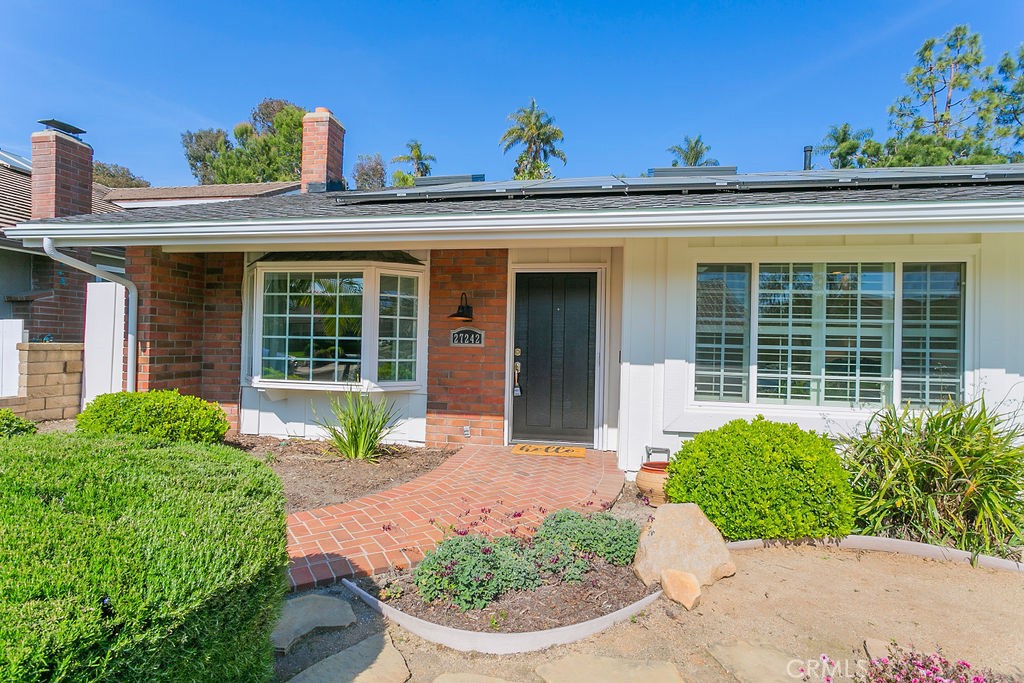 27242 Cordero Lane Mission Viejo, CA 92691 - Photo 3 of 39 a front view of a house with a yard and potted plants