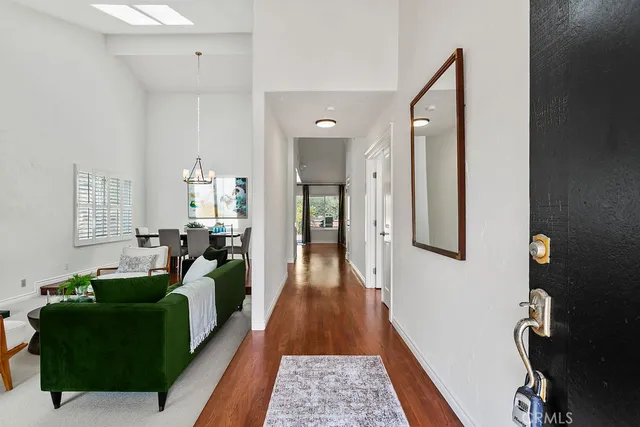 a living room with furniture and a rug