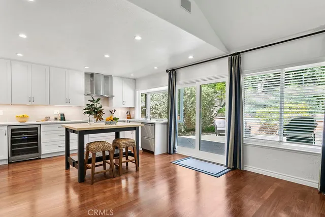 a kitchen with a table and chairs