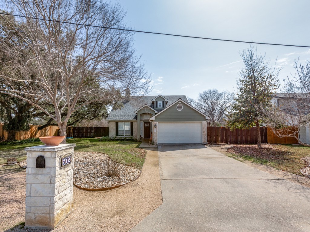 502 Toledo Trail Georgetown, TX 78628 - Photo 1 of 25 a view of a house with a yard and garage