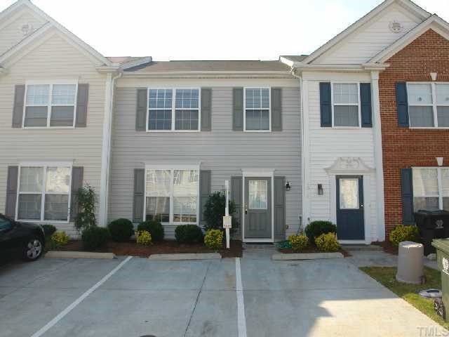 5018 Echo Ridge Road Raleigh, NC 27612 - Photo 1 of 12 a view of a brick house with many windows