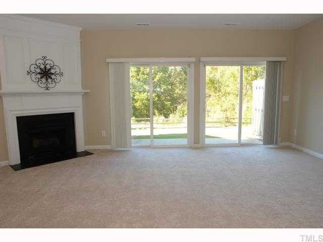 5018 Echo Ridge Road Raleigh, NC 27612 - Photo 6 of 12 a view of empty room with a fireplace