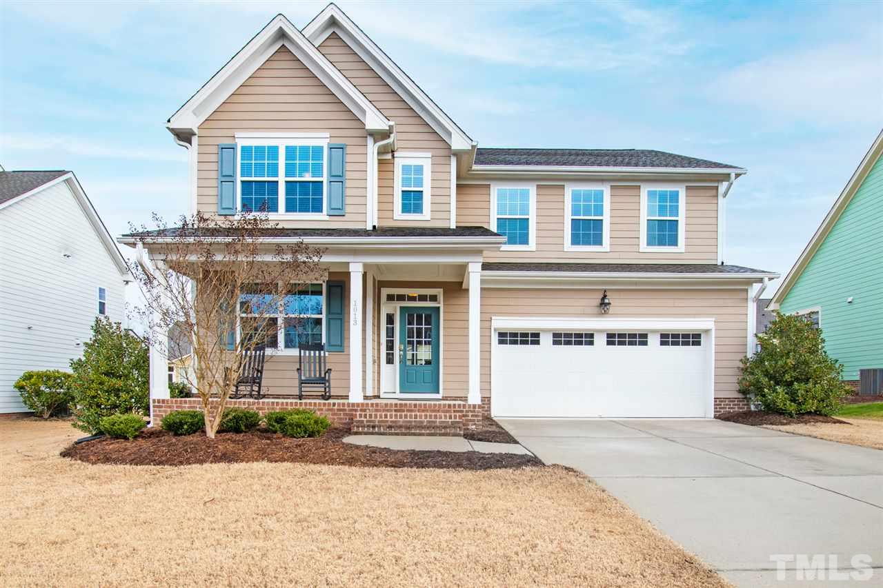 1013 Traditions Meadow Drive Wake Forest, NC 27587 - Photo 1 of 30 a front view of a house with a yard