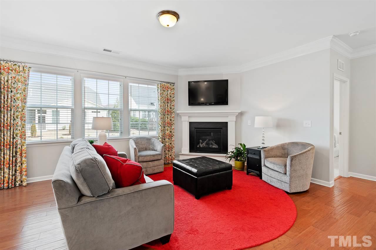 1013 Traditions Meadow Drive Wake Forest, NC 27587 - Photo 11 of 30 a living room with furniture and a fireplace