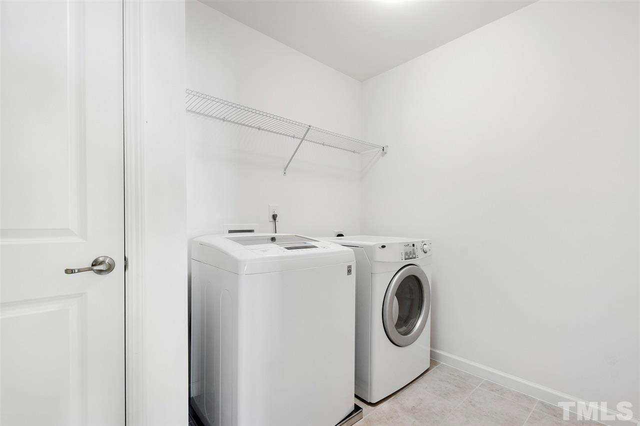 1013 Traditions Meadow Drive Wake Forest, NC 27587 - Photo 28 of 30 a utility room with dryer and washer