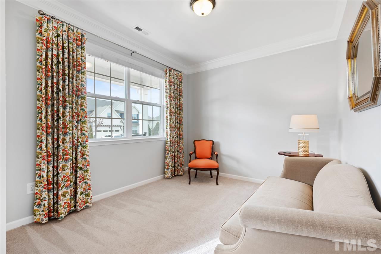 1013 Traditions Meadow Drive Wake Forest, NC 27587 - Photo 5 of 30 a living room with furniture and a window