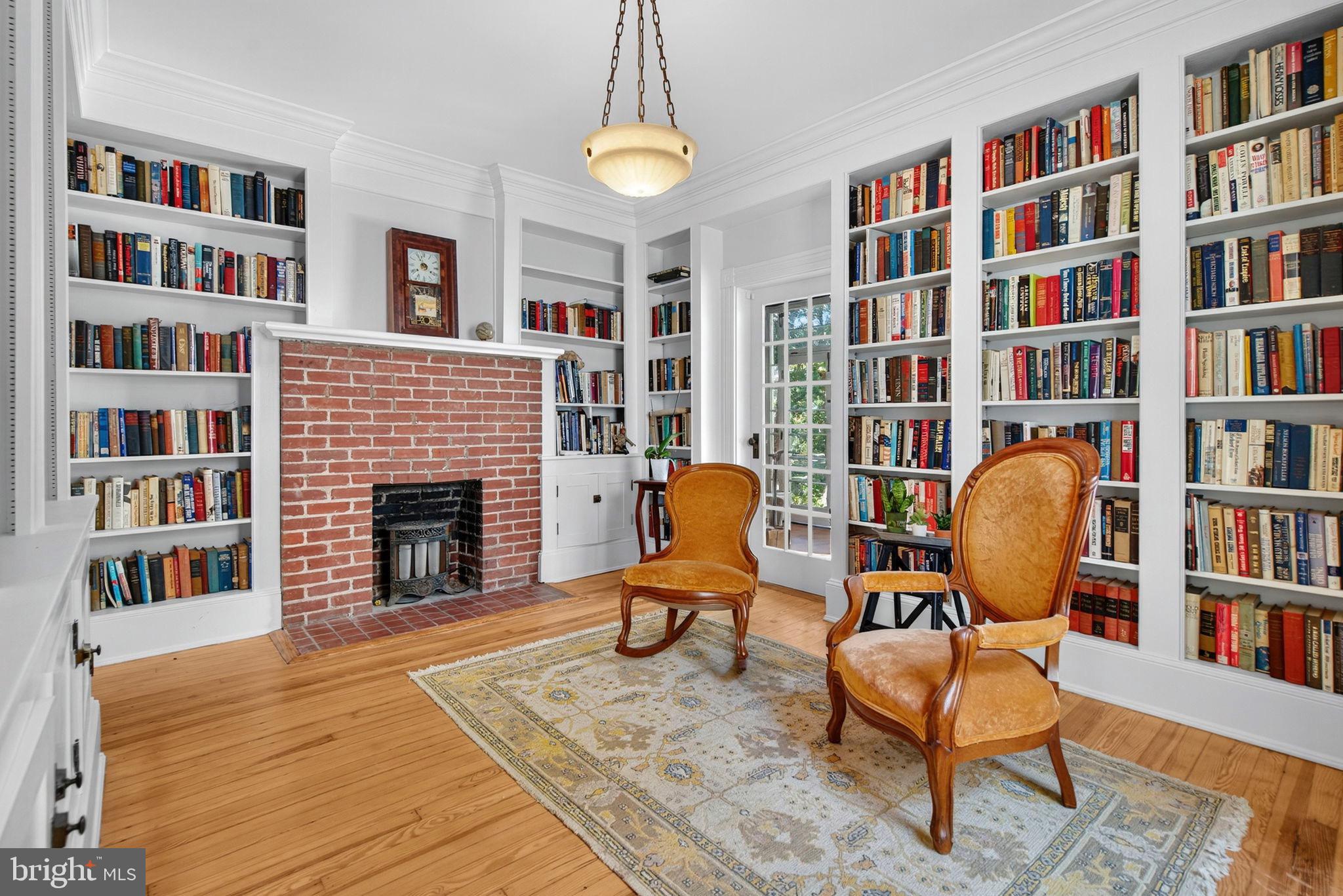 4561 Weston Road Catlett, VA 20119 - Photo 16 of 59 a living room with a bookshelf and a fireplace