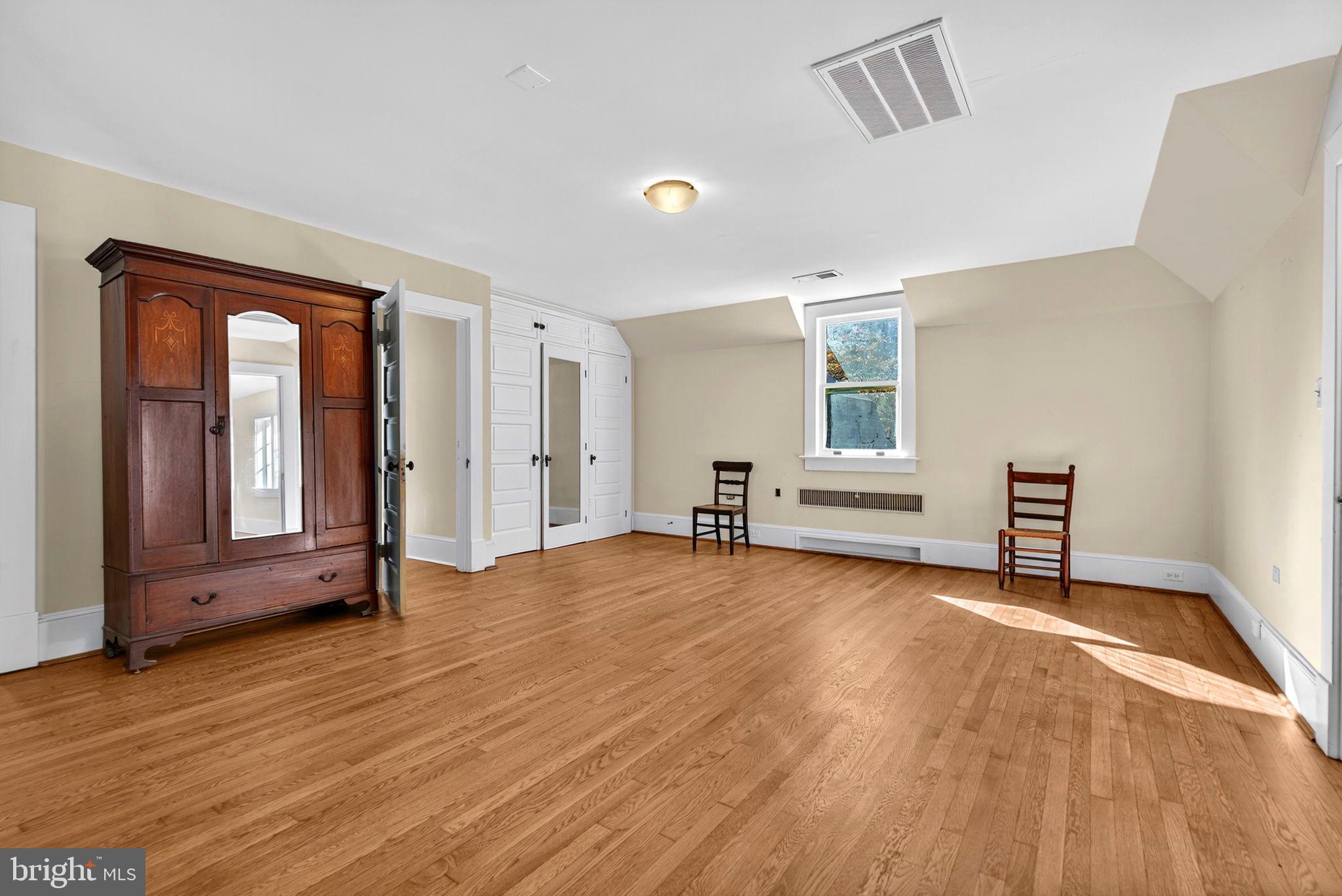 4561 Weston Road Catlett, VA 20119 - Photo 28 of 59 a view of an empty room with wooden floor and a window