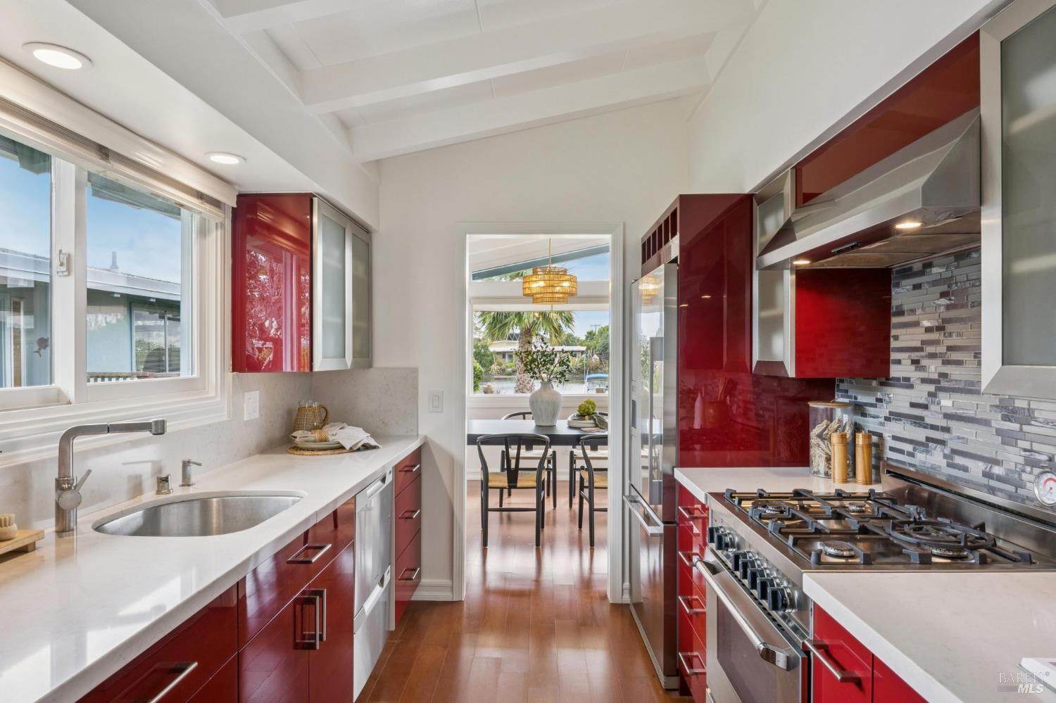 20 Porto Bello Drive San Rafael, CA 94901 - Photo 15 of 54 a kitchen with stainless steel appliances granite countertop a stove a sink dishwasher and cabinets with wooden floor