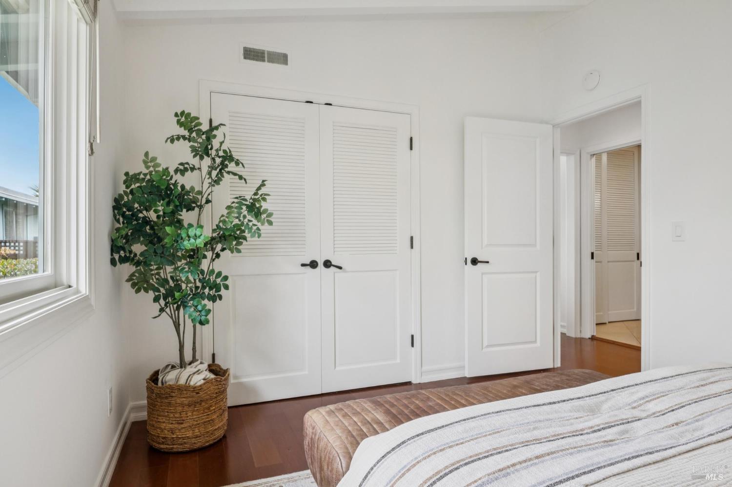 20 Porto Bello Drive San Rafael, CA 94901 - Photo 29 of 54 a bedroom with a bed and a plant