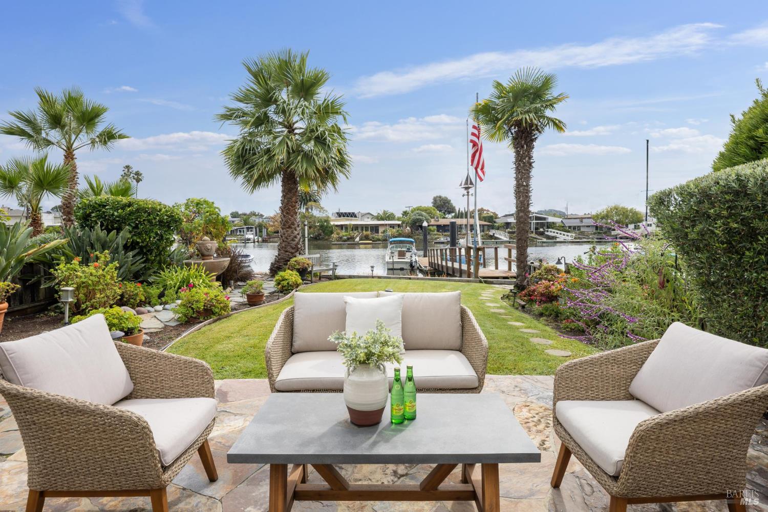 20 Porto Bello Drive San Rafael, CA 94901 - Photo 34 of 54 a view of a patio with couches potted plants and palm tree