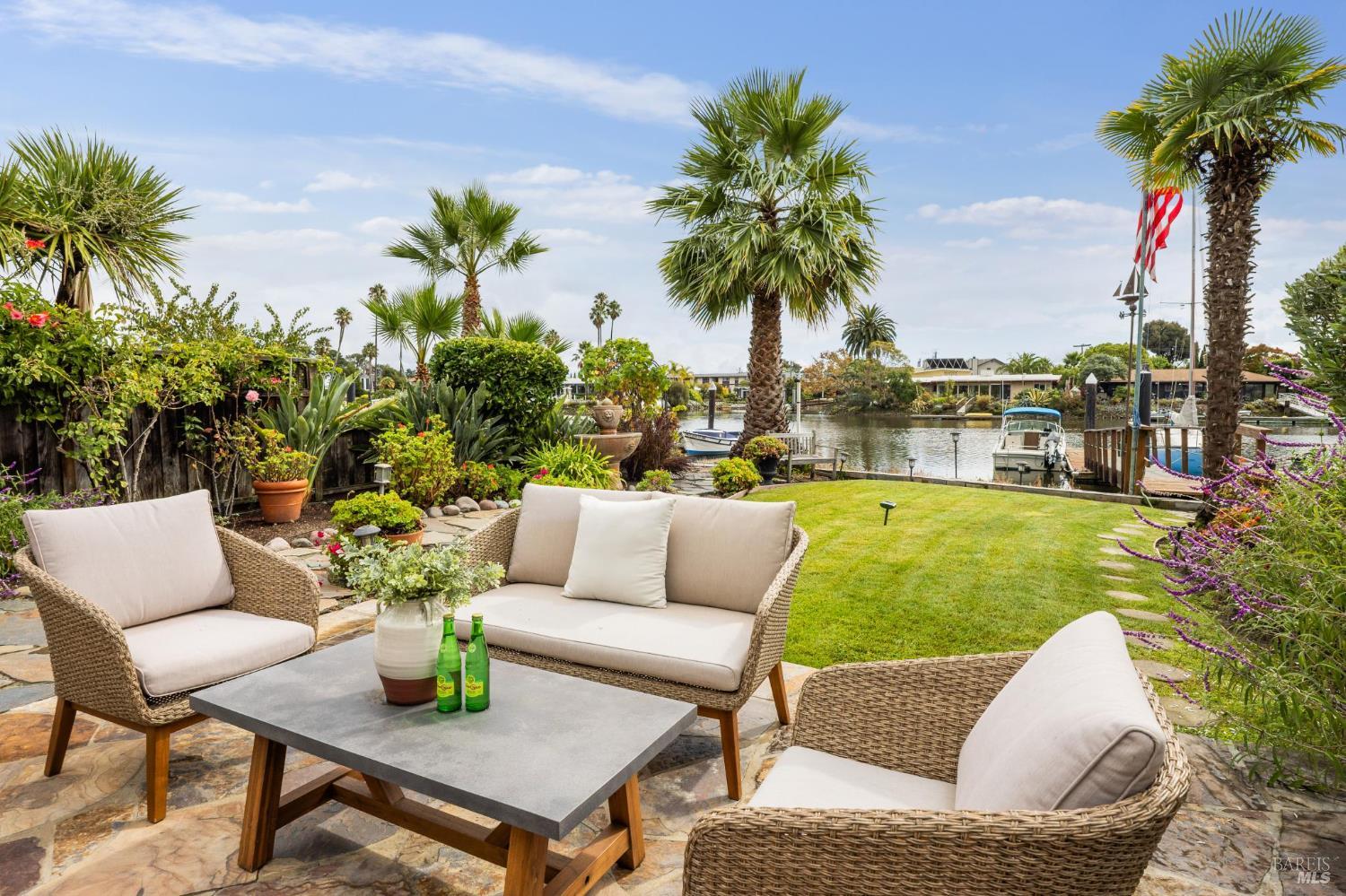 20 Porto Bello Drive San Rafael, CA 94901 - Photo 35 of 54 a view of a patio with couches and a potted plant on a table and chairs