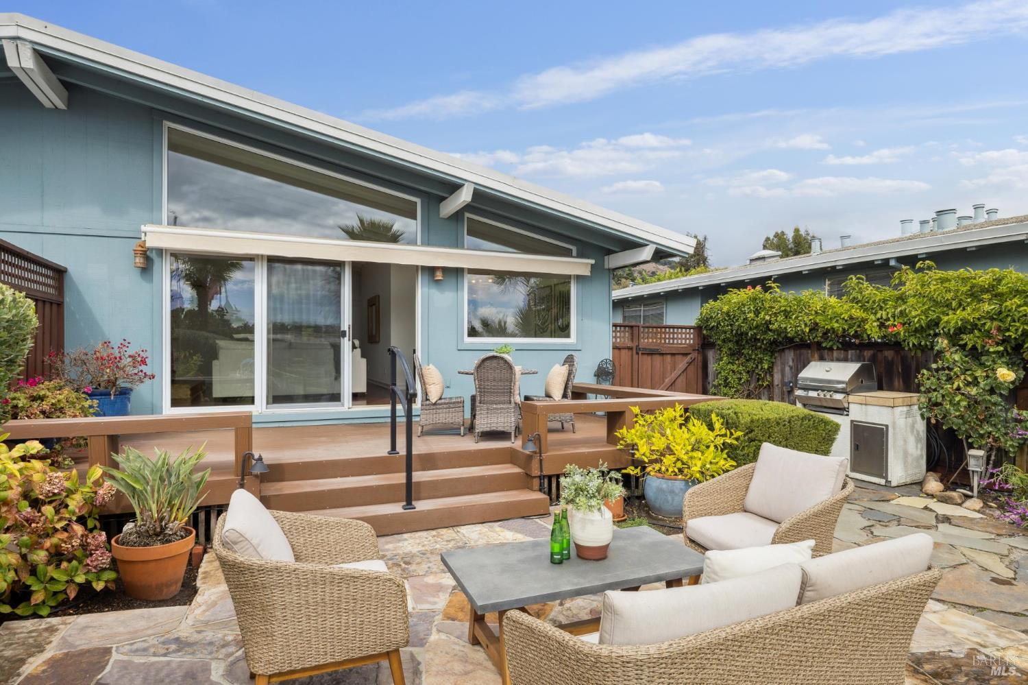 20 Porto Bello Drive San Rafael, CA 94901 - Photo 36 of 54 a view of a patio with couches table and chairs and potted plants