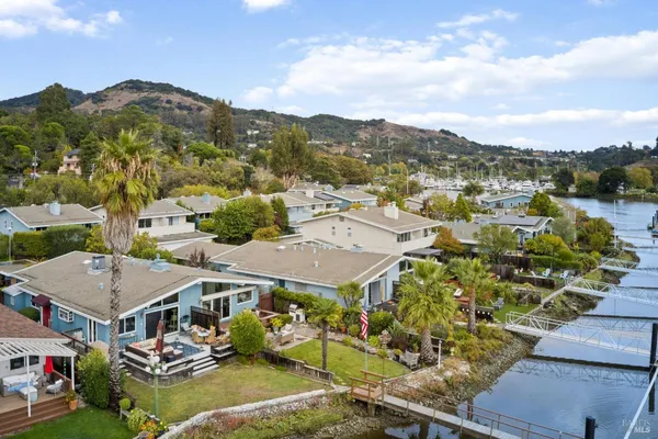 an aerial view of residential house with outdoor space and lake view