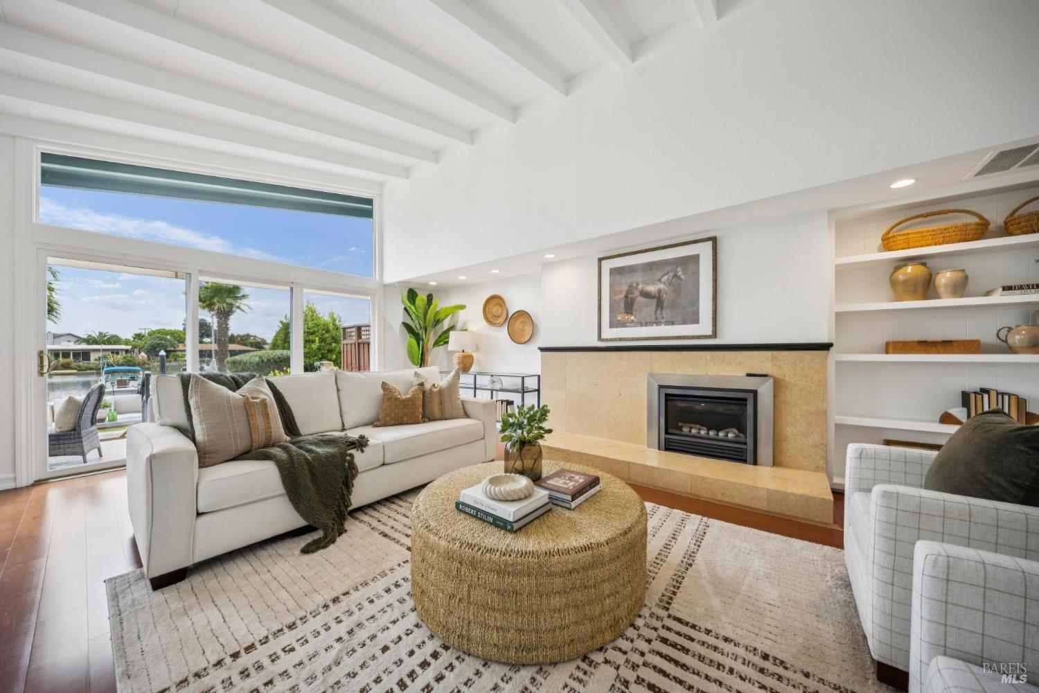 20 Porto Bello Drive San Rafael, CA 94901 - Photo 9 of 54 a living room with furniture a fireplace and a large window