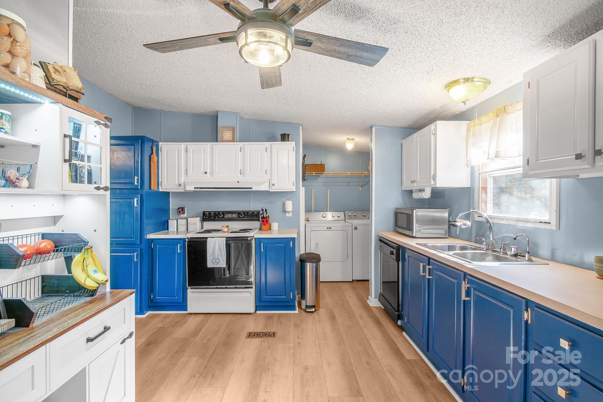 2214 Sojourn Road Marshville, NC 28103 - Photo 21 of 48 a kitchen with stainless steel appliances granite countertop a stove and cabinets
