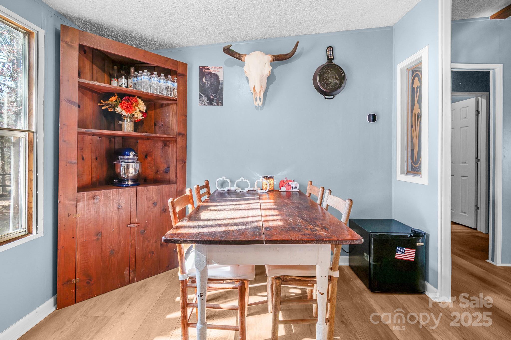 2214 Sojourn Road Marshville, NC 28103 - Photo 23 of 48 a view of a dining room with furniture