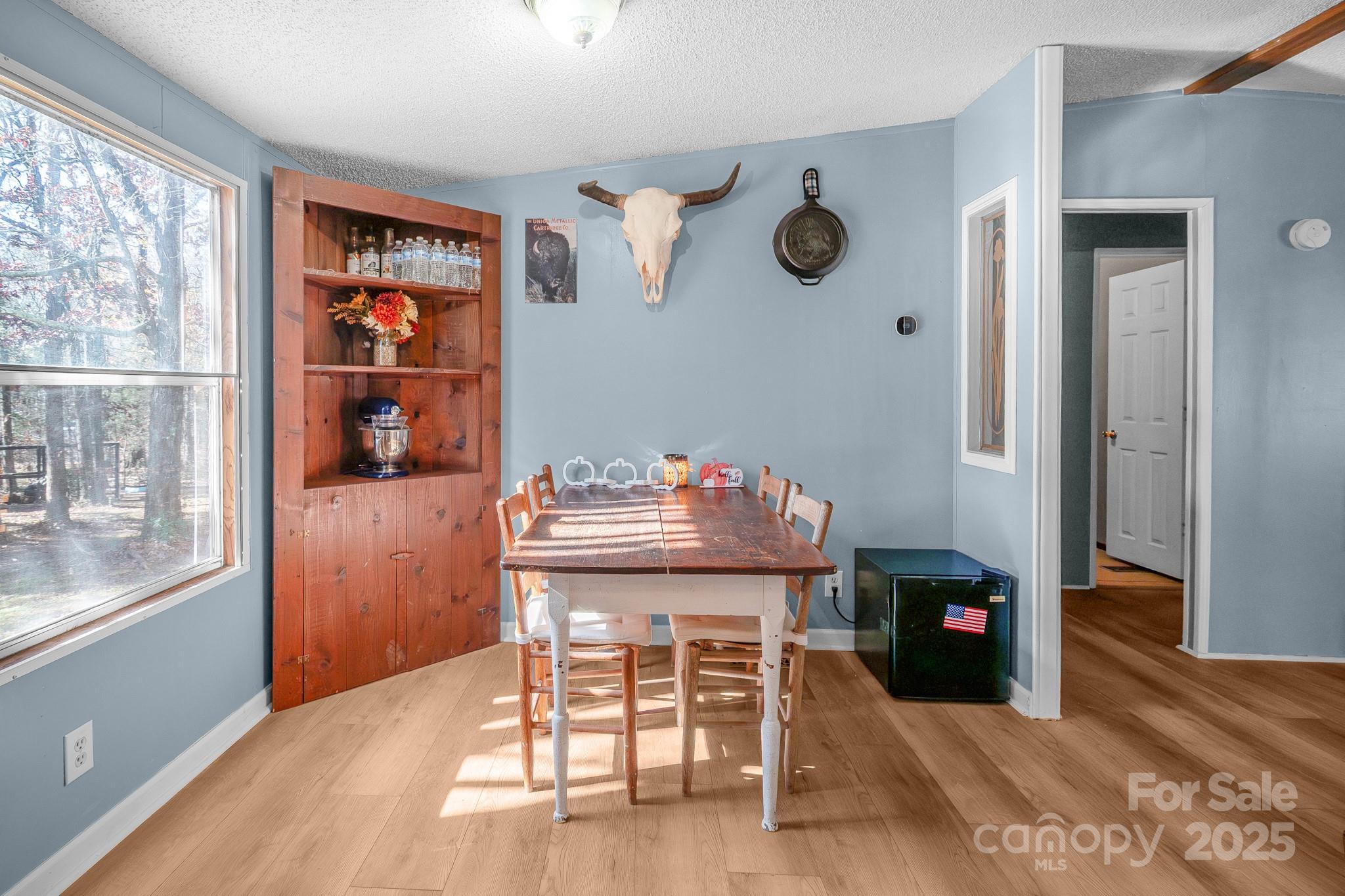 2214 Sojourn Road Marshville, NC 28103 - Photo 24 of 48 a view of a dining room with furniture and window