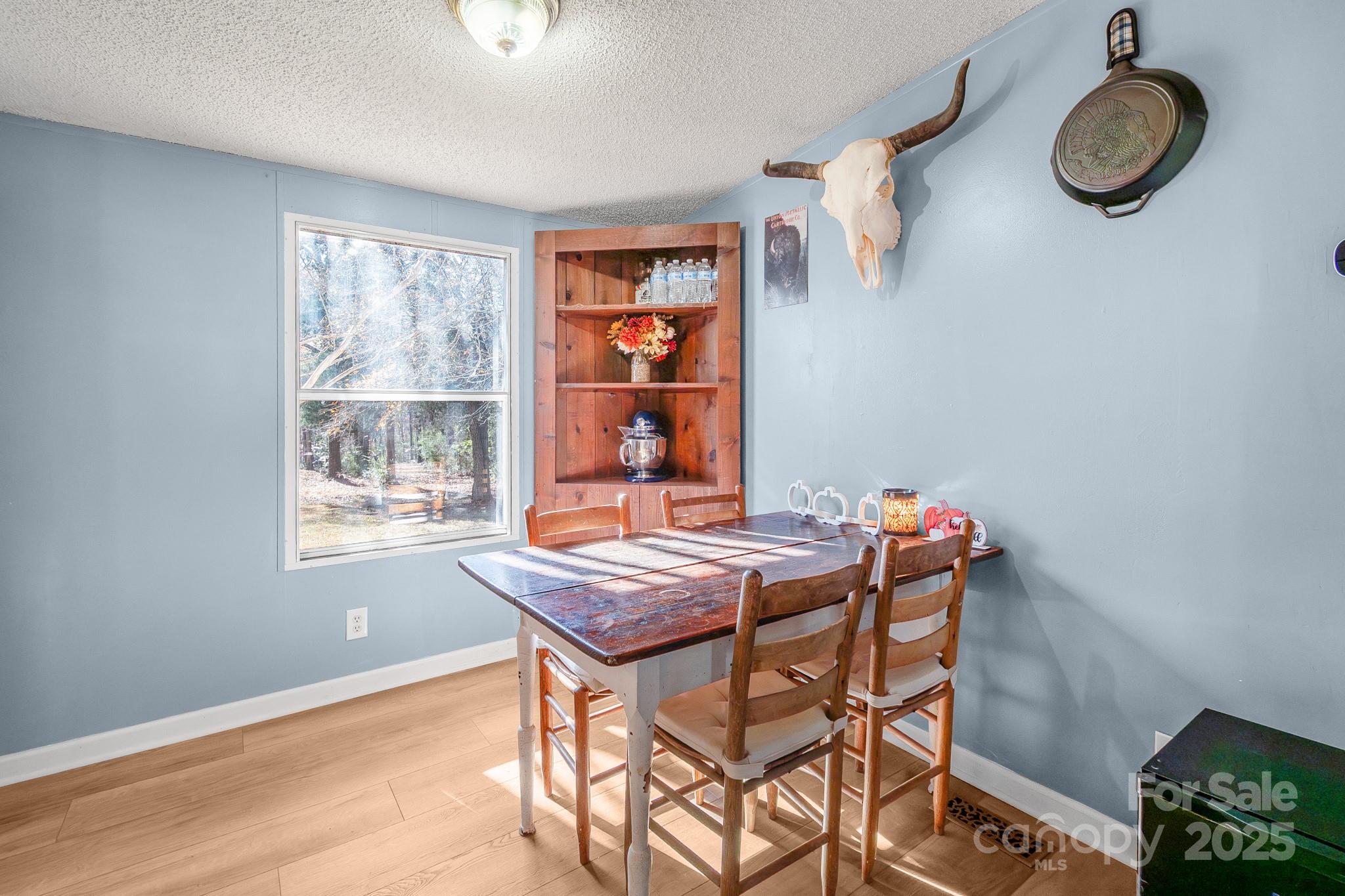 2214 Sojourn Road Marshville, NC 28103 - Photo 25 of 48 a dining room with a window and furniture