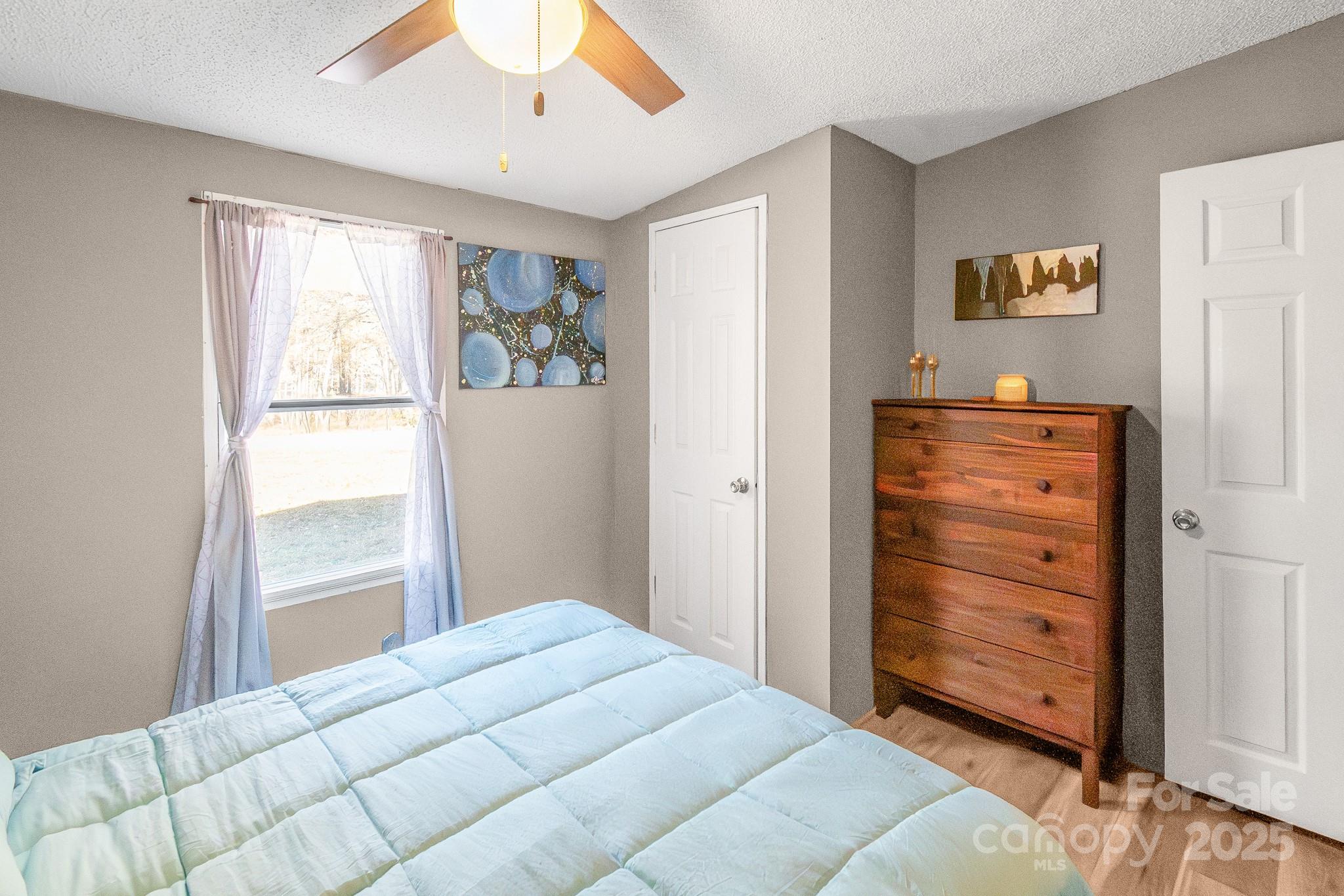 2214 Sojourn Road Marshville, NC 28103 - Photo 27 of 48 a bedroom with a bed and a window