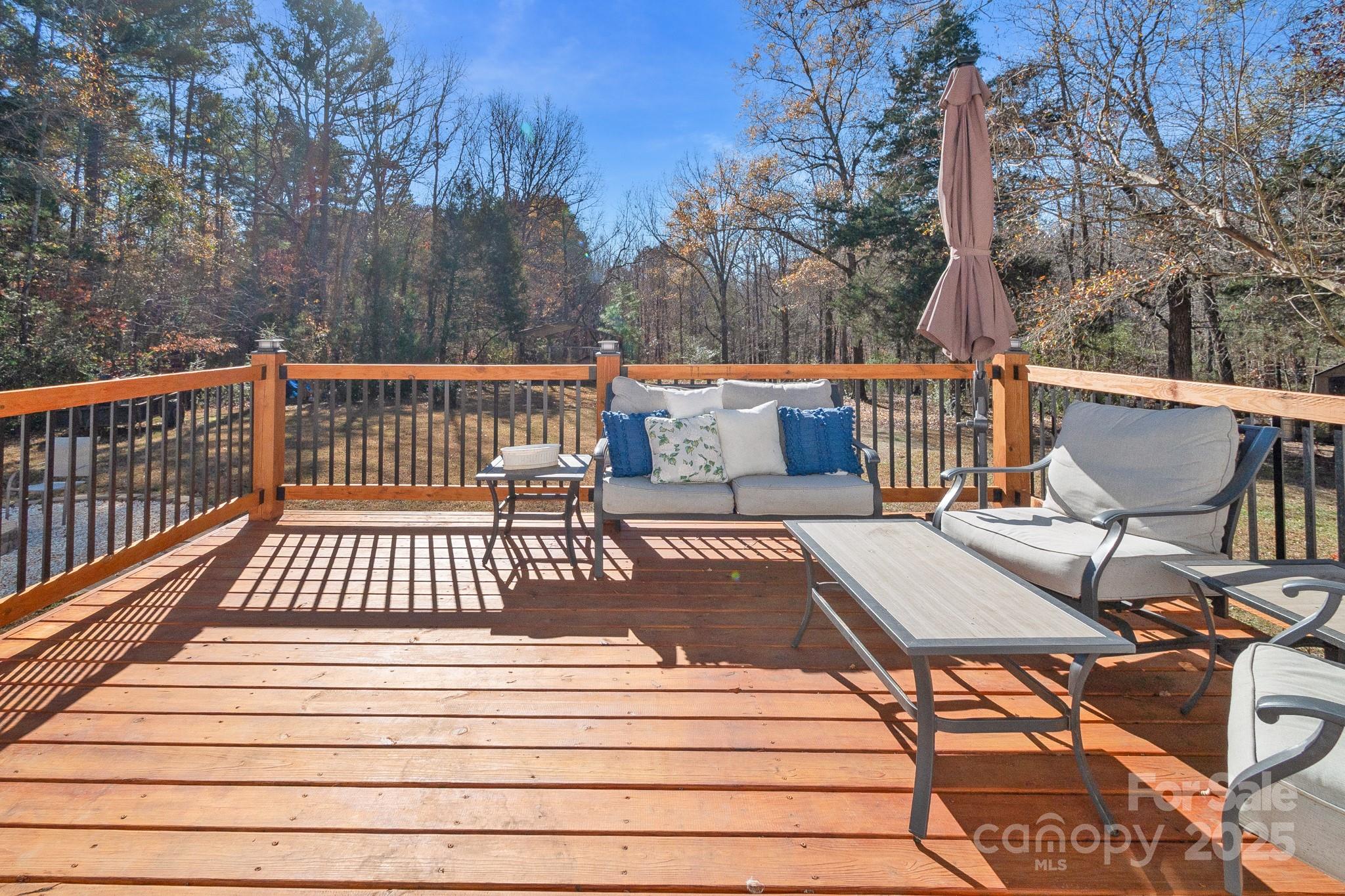 2214 Sojourn Road Marshville, NC 28103 - Photo 30 of 48 a view of balcony with wooden floor and outdoor seating
