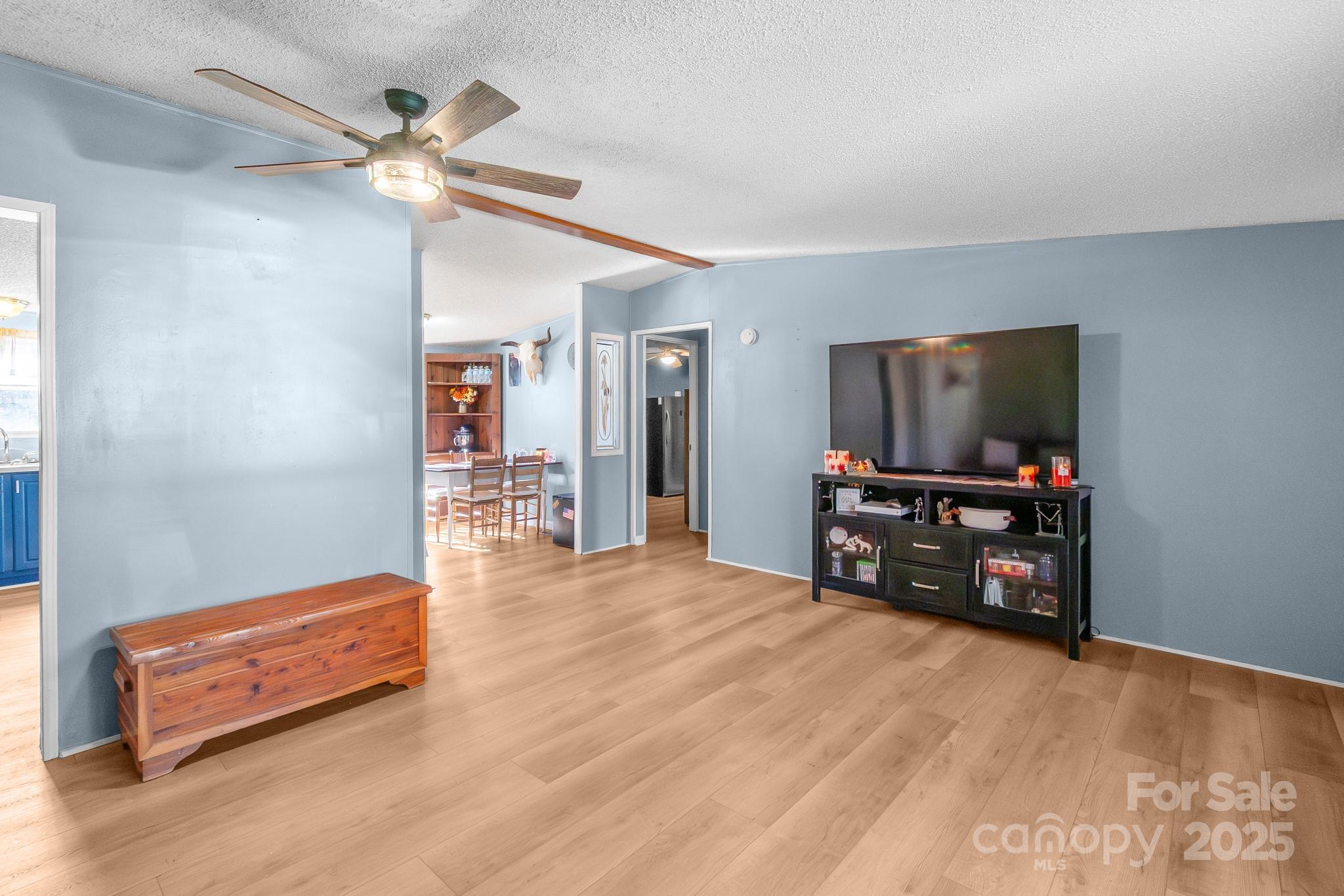 2214 Sojourn Road Marshville, NC 28103 - Photo 3 of 48 a room with furniture and a flat screen tv