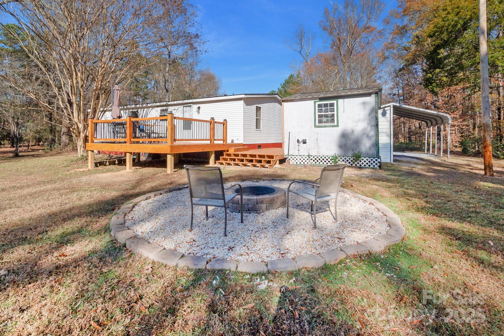 2214 Sojourn Road Marshville, NC 28103 - Photo 40 of 48 a view of a house with backyard and sitting area