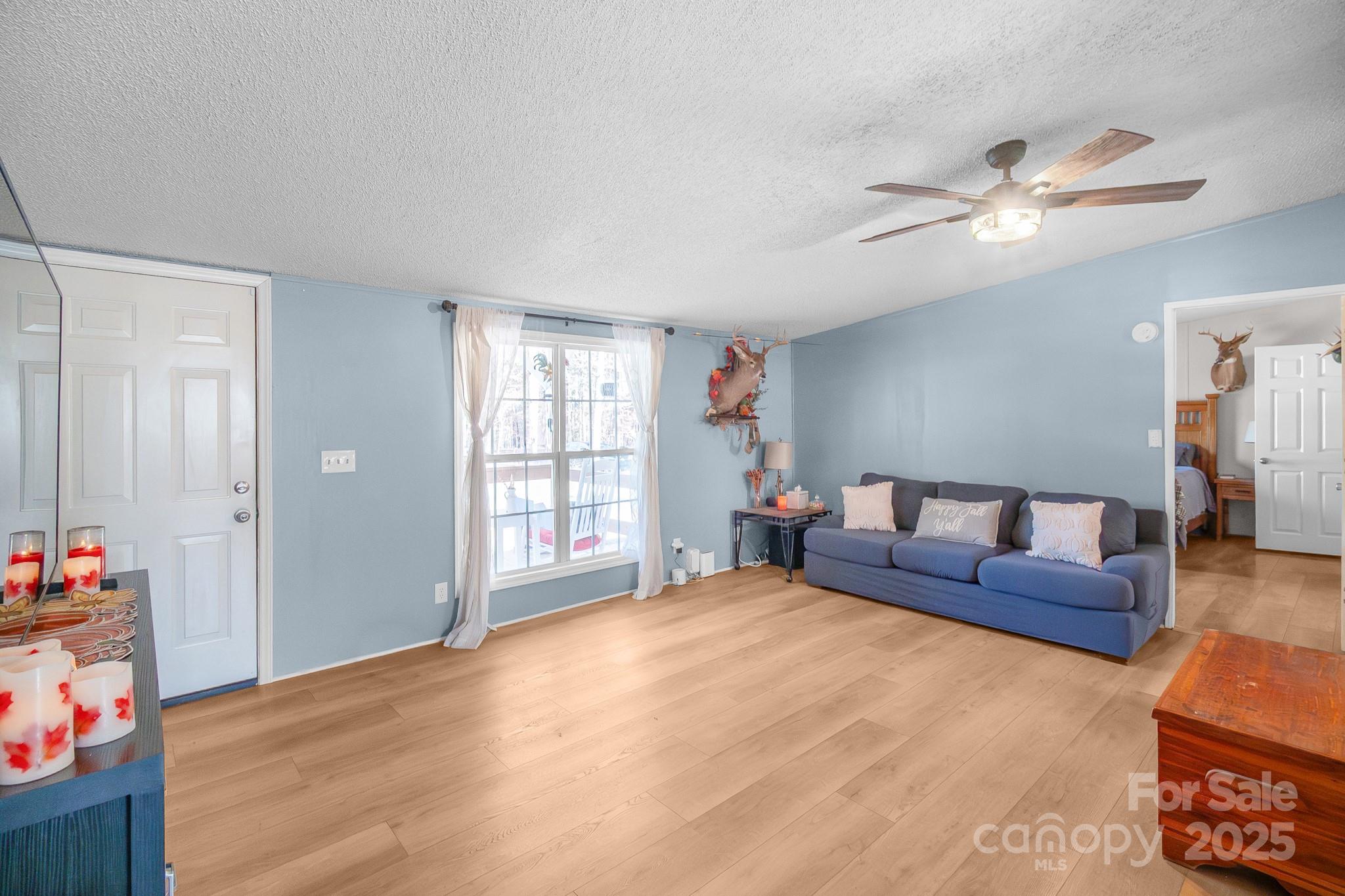 2214 Sojourn Road Marshville, NC 28103 - Photo 10 of 48 a living room with furniture and a window