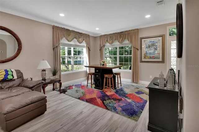 a view of a dining room with furniture window and wooden floor
