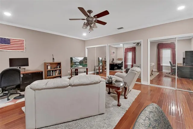 a spacious bathroom with a double vanity sink a two mirror and a tub