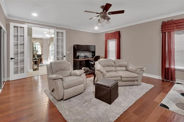 a en suite bathroom with a granite countertop sink and a mirror