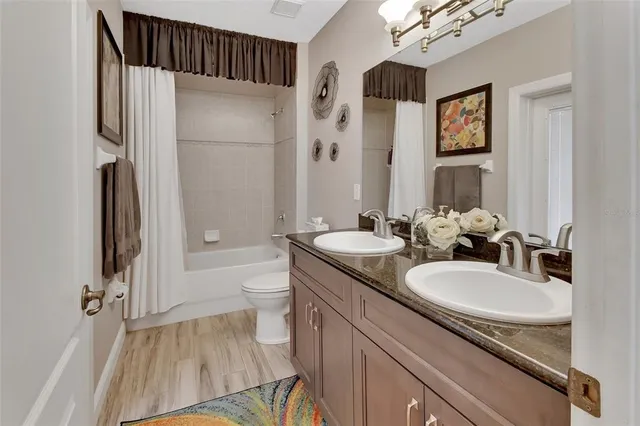 a view of a chairs and table in the balcony