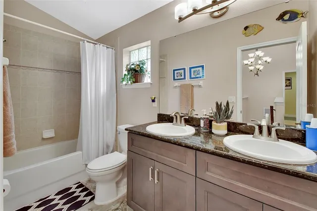 a view of a house with backyard and garden