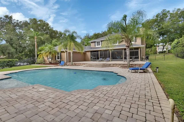 a view of a hallway with wooden floor and stairs
