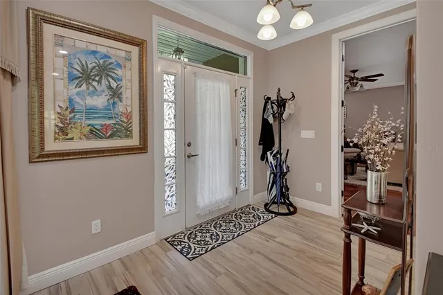 a living room with furniture a rug and a large window