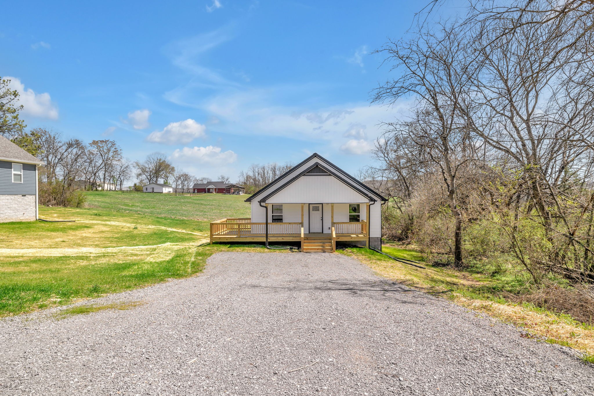127 Lock 6 Road Hartsville, TN 37074 - Photo 1 of 35 a view of a house with a yard and large tree
