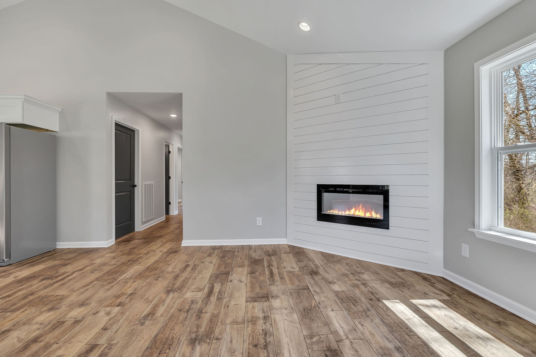 127 Lock 6 Road Hartsville, TN 37074 - Photo 11 of 35 a view of an empty room with wooden floor and a window