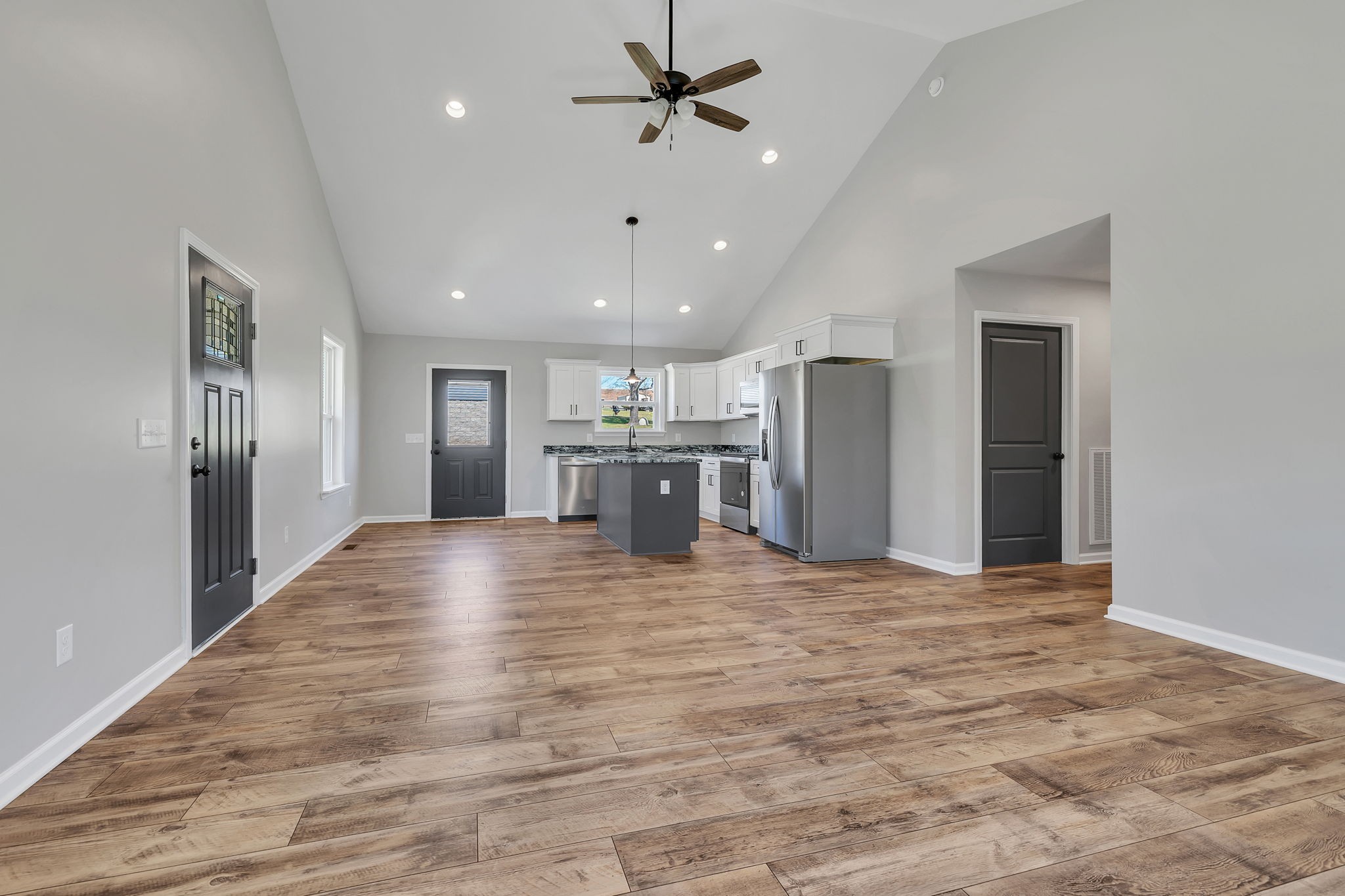 127 Lock 6 Road Hartsville, TN 37074 - Photo 12 of 35 a view of kitchen with refrigerator stove and wooden floor