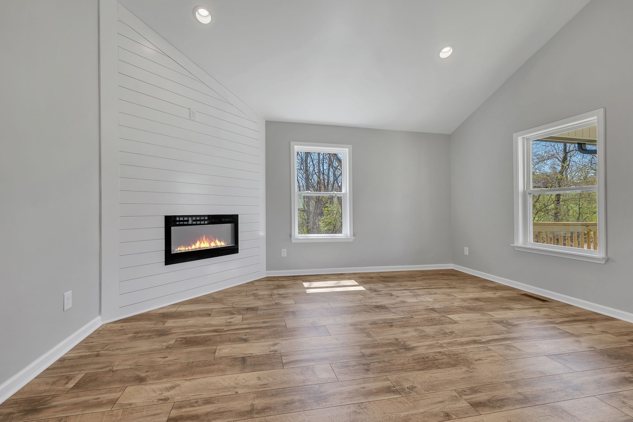 127 Lock 6 Road Hartsville, TN 37074 - Photo 13 of 35 a view of an empty room with a window and a fireplace