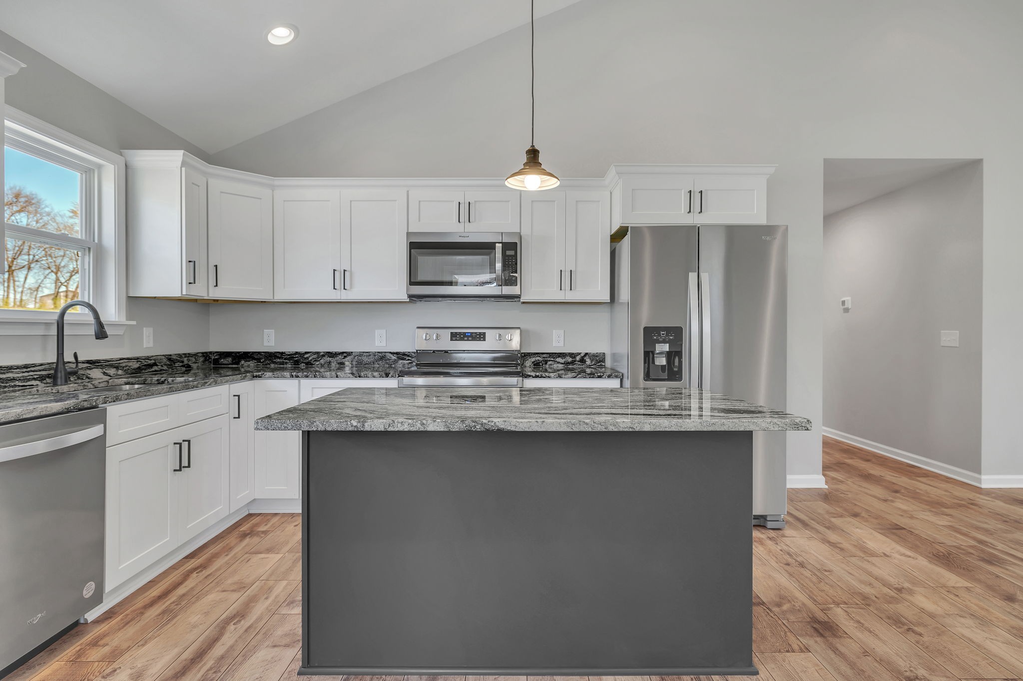 127 Lock 6 Road Hartsville, TN 37074 - Photo 15 of 35 a kitchen with kitchen island granite countertop a sink cabinets and stainless steel appliances