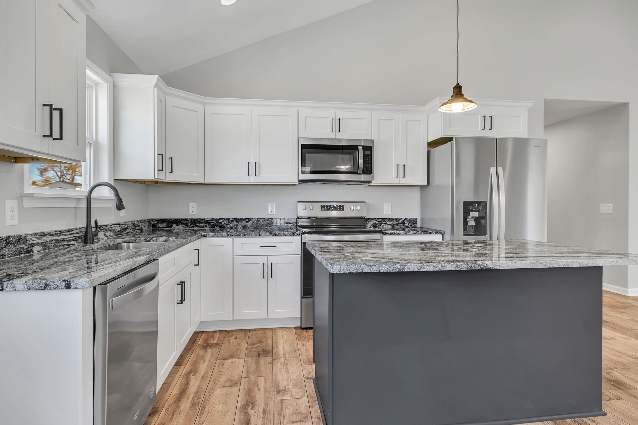 127 Lock 6 Road Hartsville, TN 37074 - Photo 16 of 35 a kitchen with stainless steel appliances granite countertop a sink stove and refrigerator