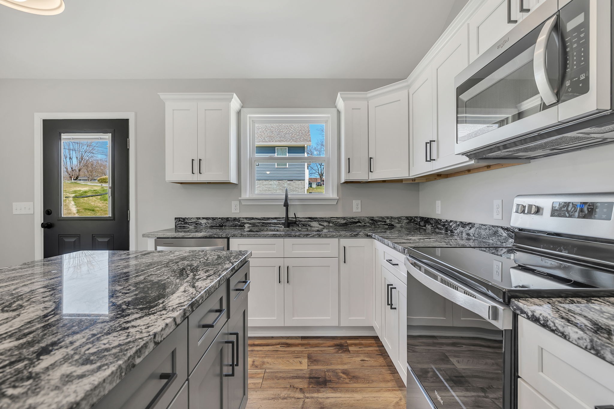 127 Lock 6 Road Hartsville, TN 37074 - Photo 17 of 35 a kitchen with stainless steel appliances granite countertop a stove sink and cabinets