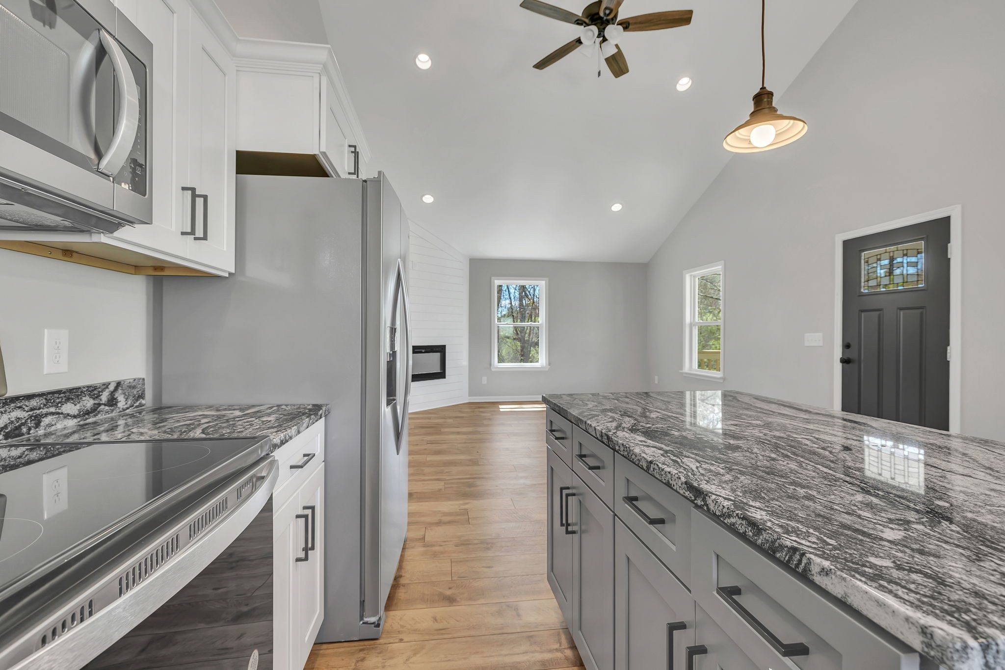 127 Lock 6 Road Hartsville, TN 37074 - Photo 18 of 35 a kitchen with granite countertop a sink stainless steel appliances and cabinets