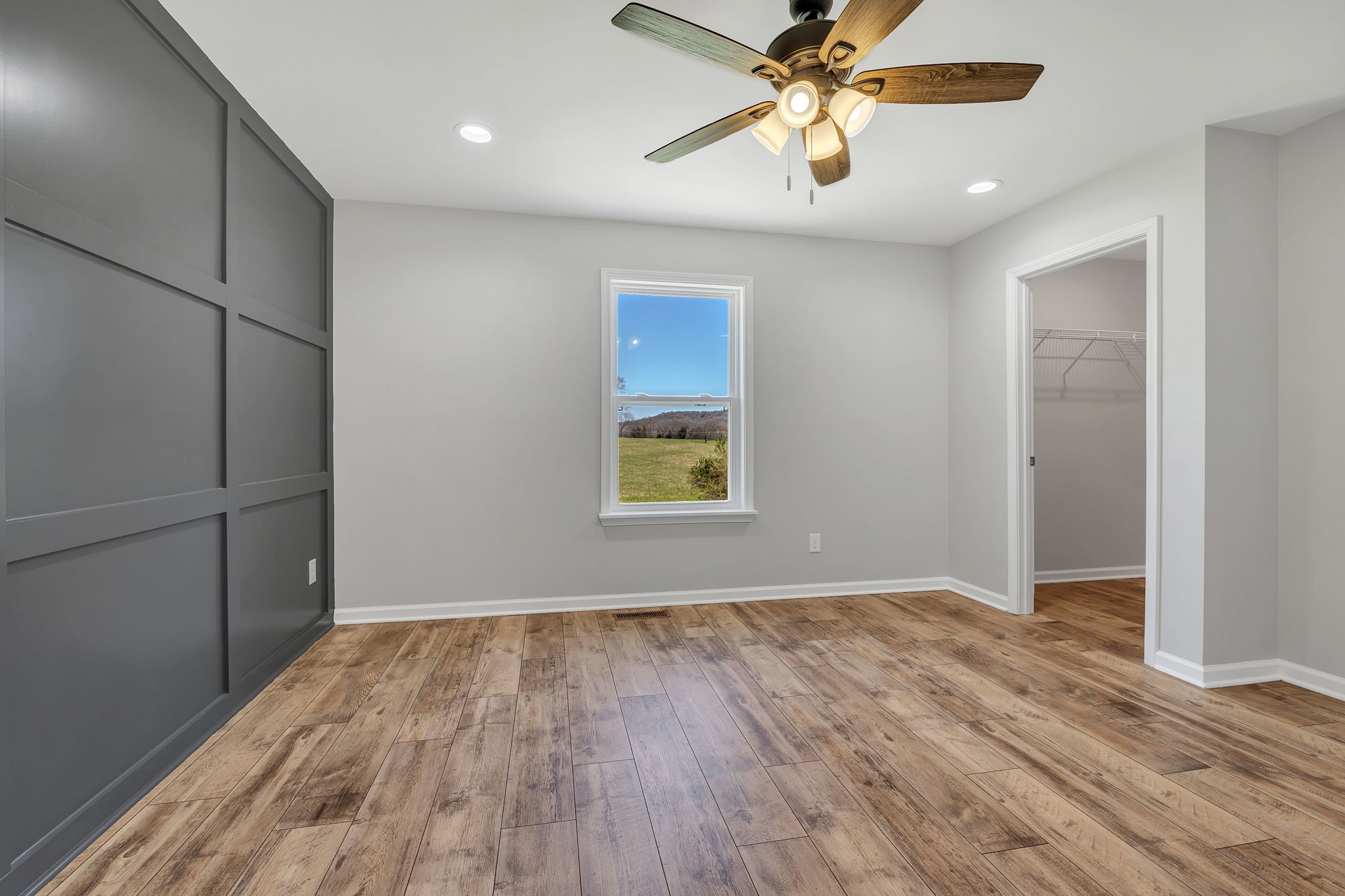 127 Lock 6 Road Hartsville, TN 37074 - Photo 21 of 35 a view of an empty room with window and wooden floor