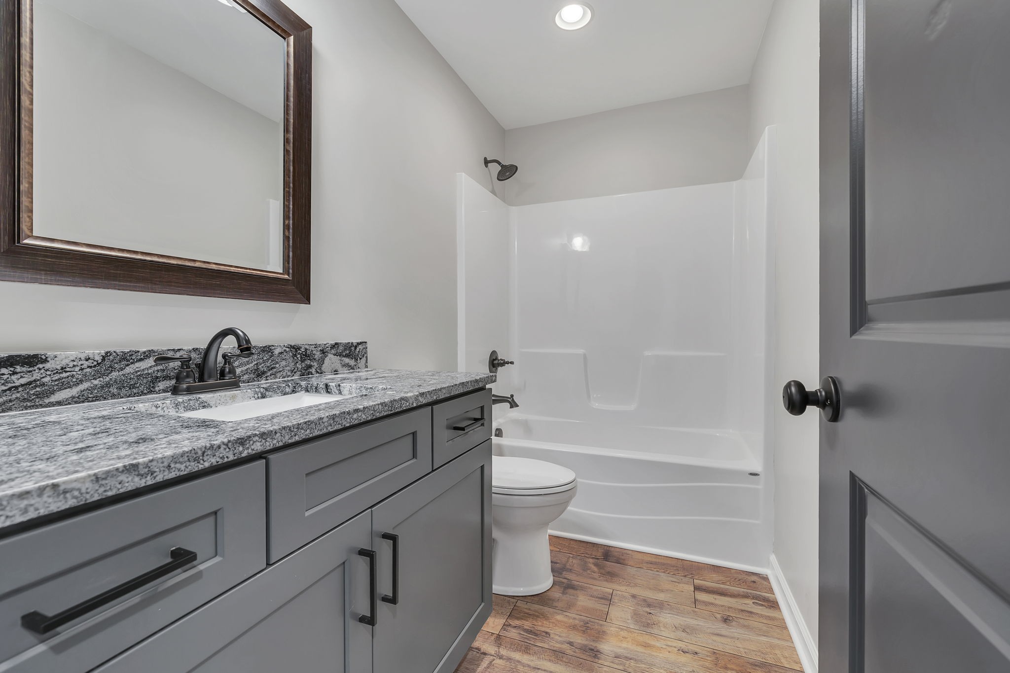 127 Lock 6 Road Hartsville, TN 37074 - Photo 28 of 35 a bathroom with a granite countertop sink toilet and shower