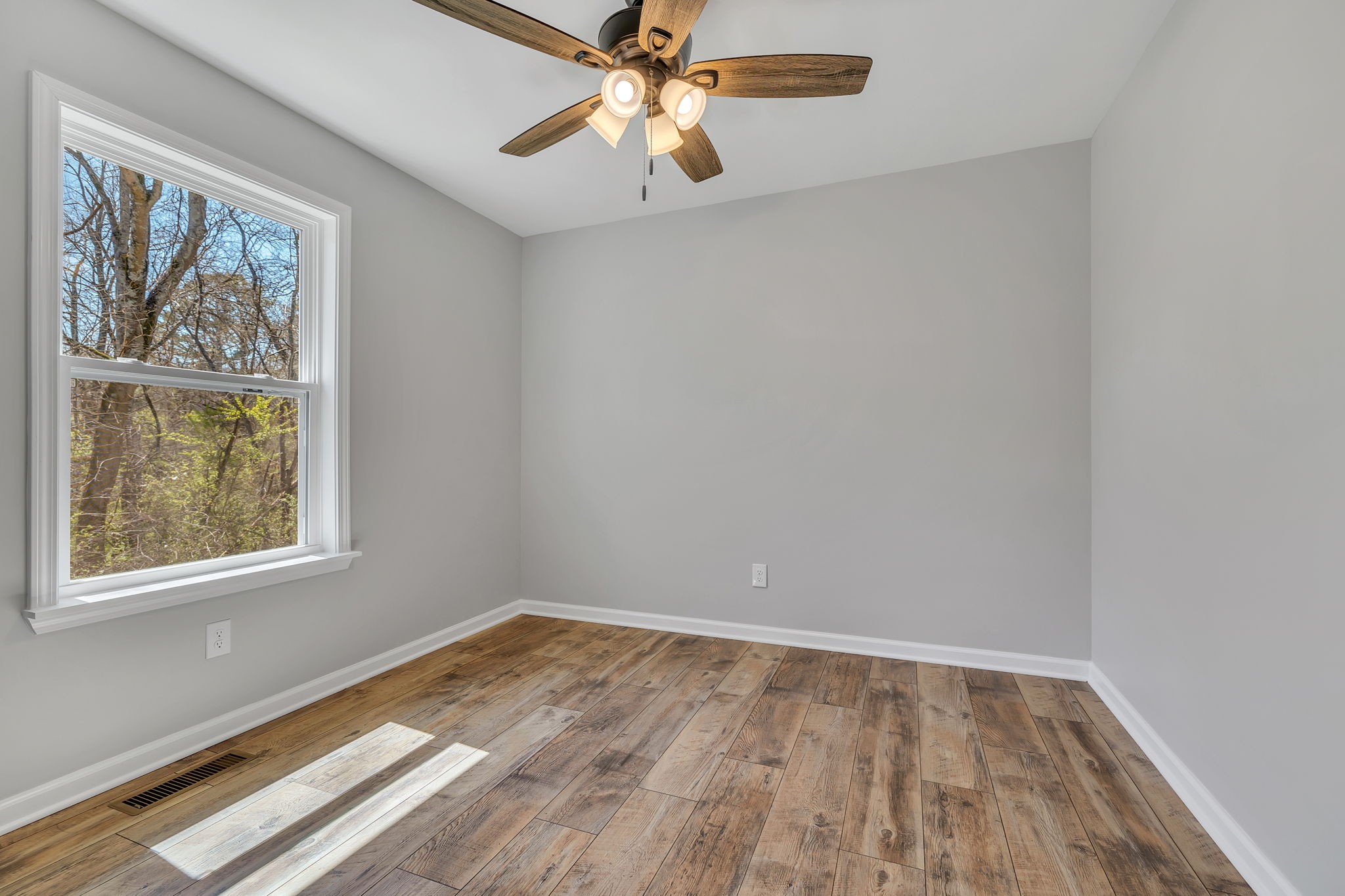127 Lock 6 Road Hartsville, TN 37074 - Photo 29 of 35 wooden floor in an empty room with a window