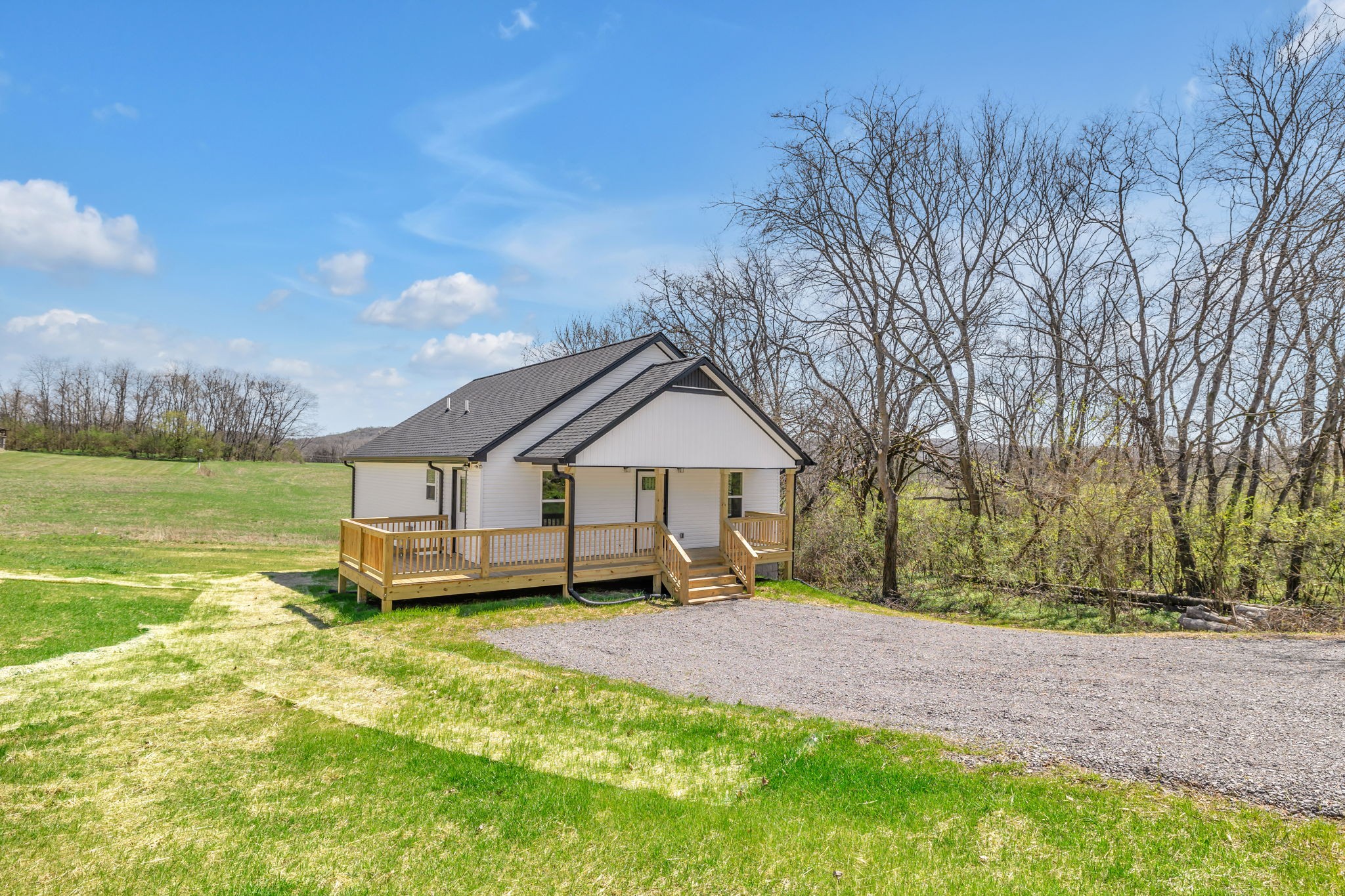 127 Lock 6 Road Hartsville, TN 37074 - Photo 3 of 35 a house view with a garden space