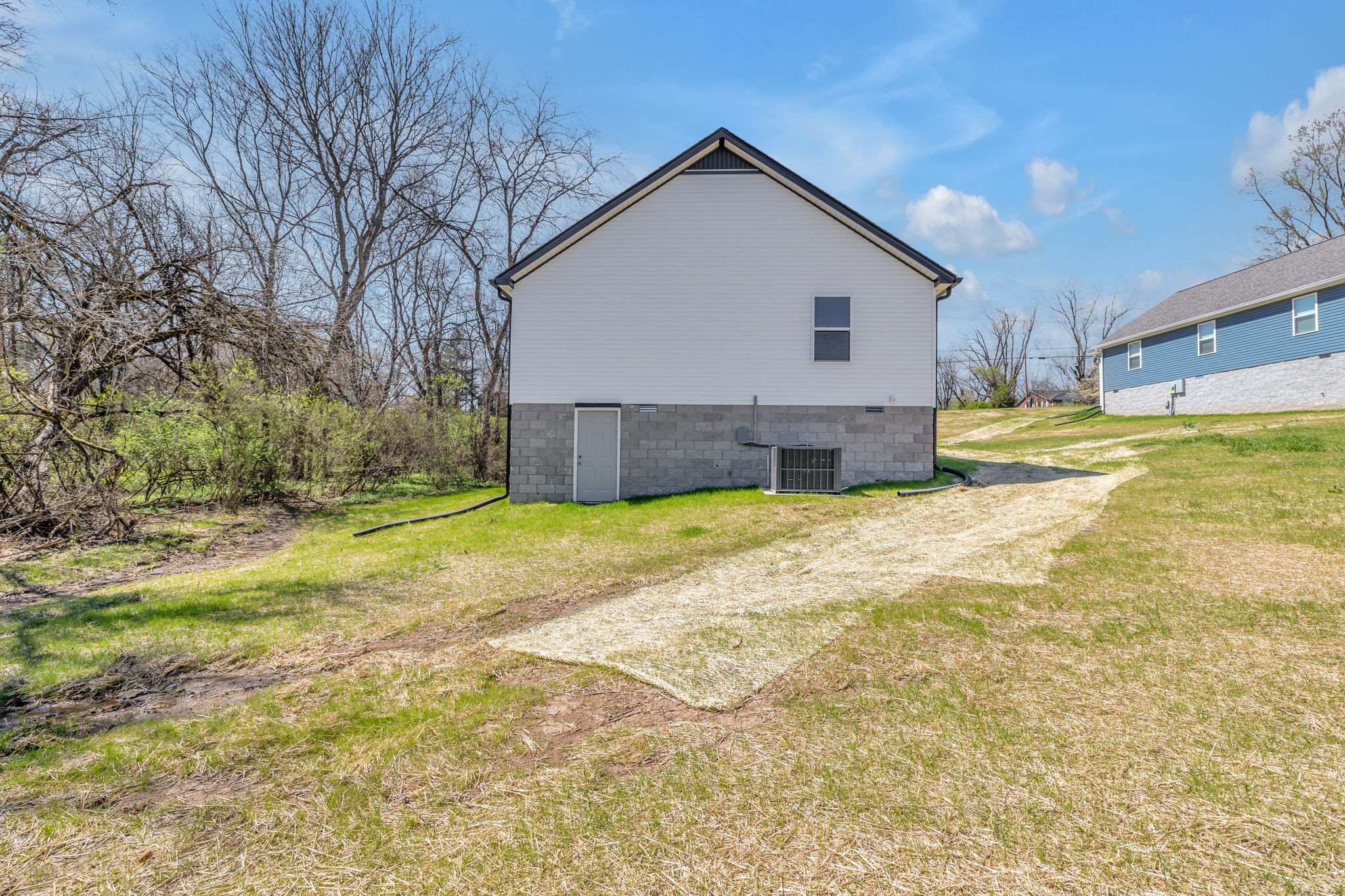 127 Lock 6 Road Hartsville, TN 37074 - Photo 34 of 35 a view of a house with a yard and a large tree