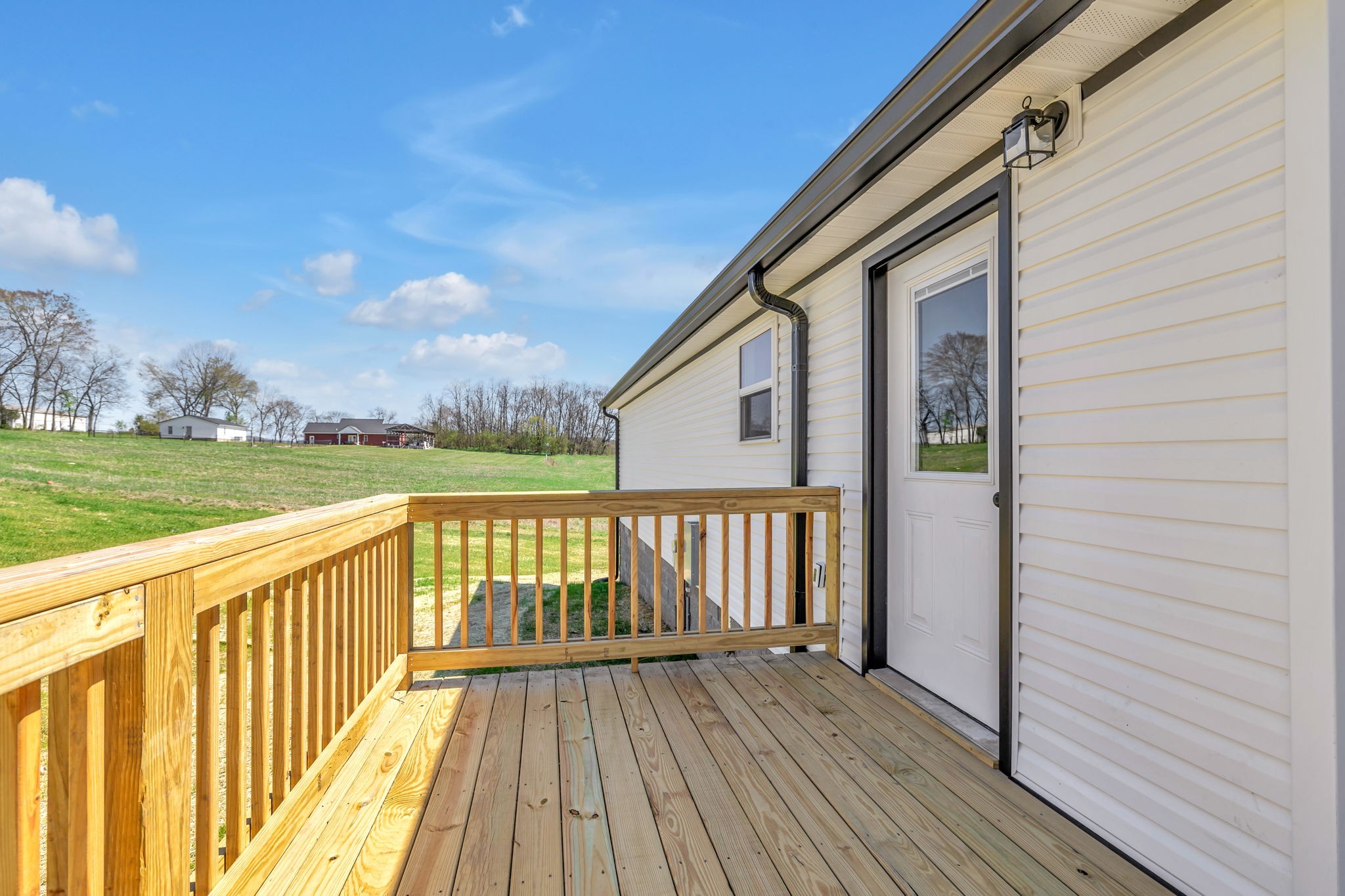 127 Lock 6 Road Hartsville, TN 37074 - Photo 7 of 35 a view of balcony with wooden floor and fence