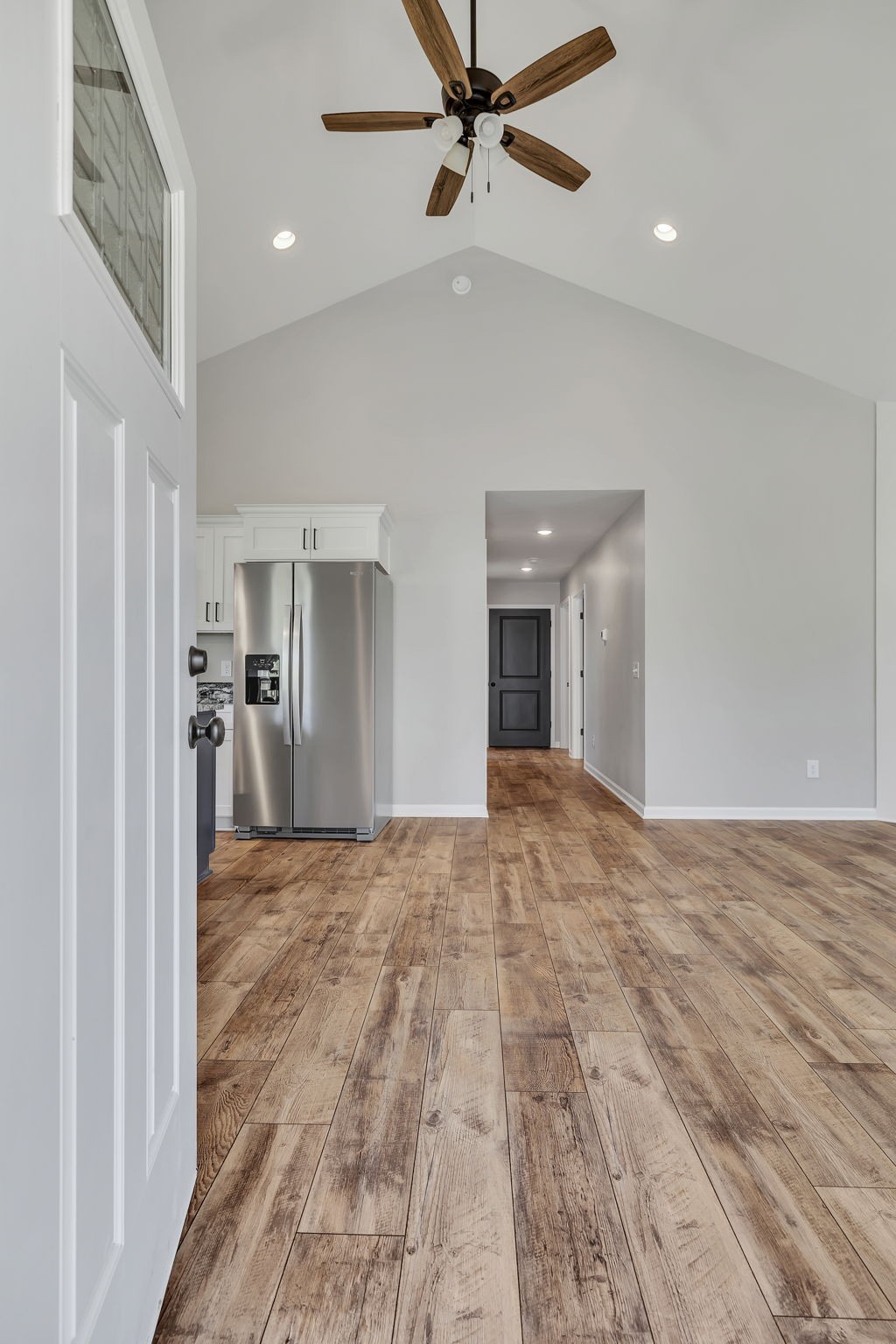 127 Lock 6 Road Hartsville, TN 37074 - Photo 9 of 35 a view of a big room with wooden floor and a kitchen